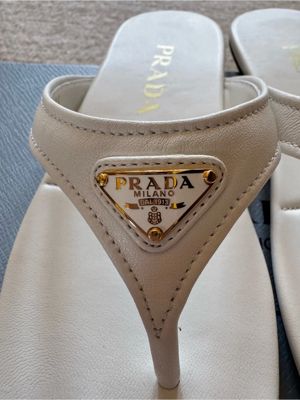 Prada designer white Leather Thong Sandals with Gold Triangle Logo